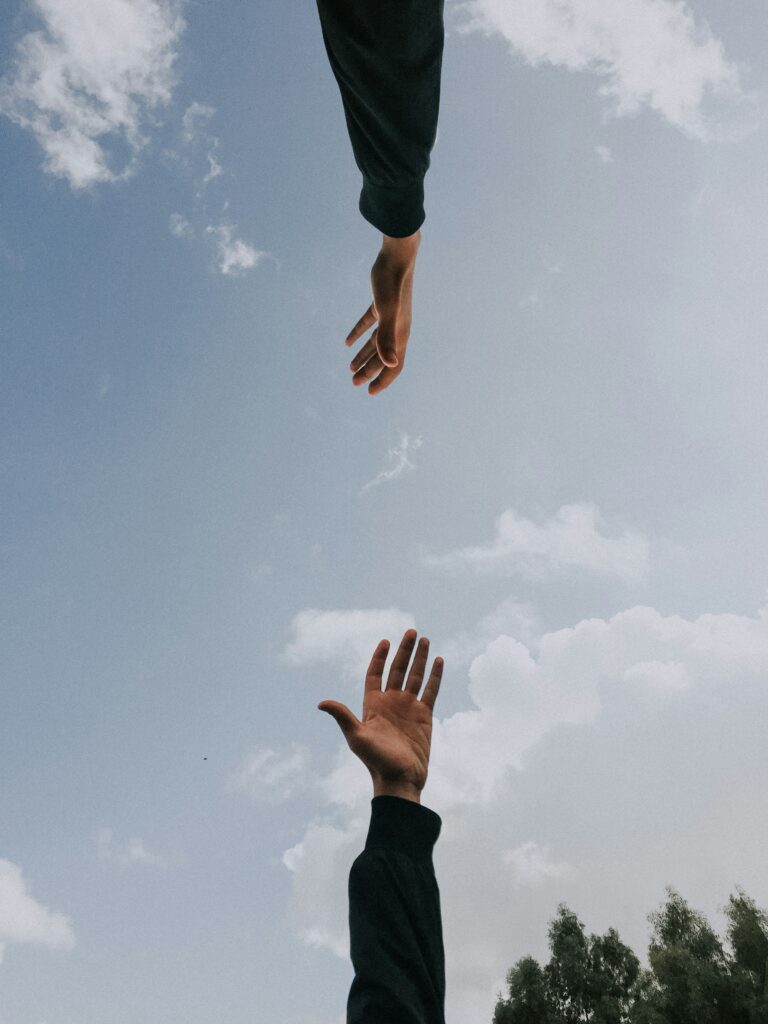 Two person's arms Photo by youssef naddam on Unsplash